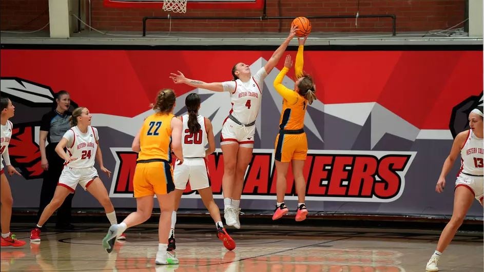 Rachel Cockman jumps for the basketball during a game.
