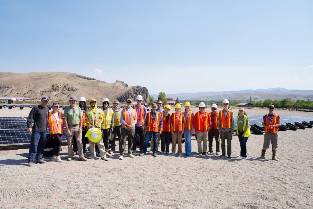 Group photo of all employees helping assemble Powerfield's seventy-five row solar array in Gunnison (including a handful of Western students).