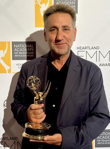 Julian Rubinstein holds his Emmy Award.