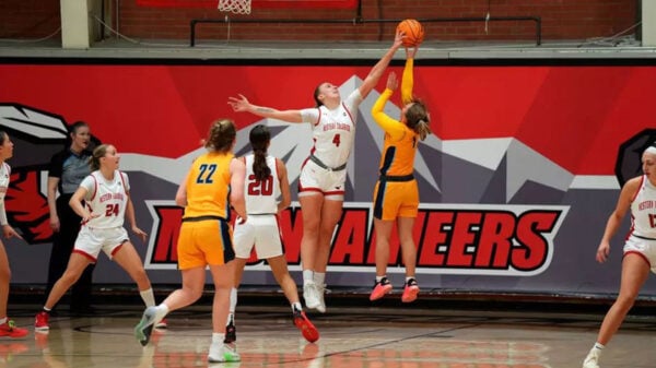 Rachel Cockman jumps for the basketball during a game.