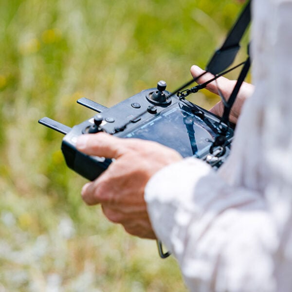 A RMBL employee pilots a drone.