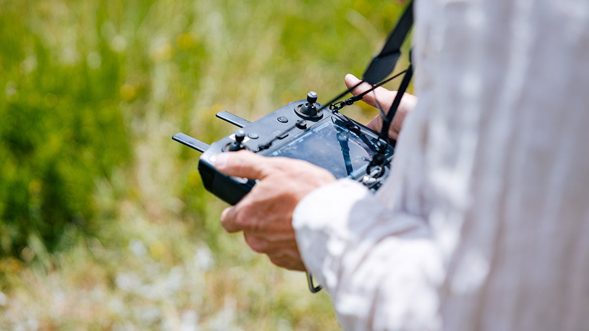 A RMBL employee pilots a drone.