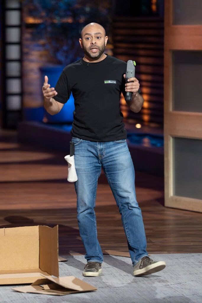 Rob Wrights shows the Box Blade to the judges on Shark Tank.