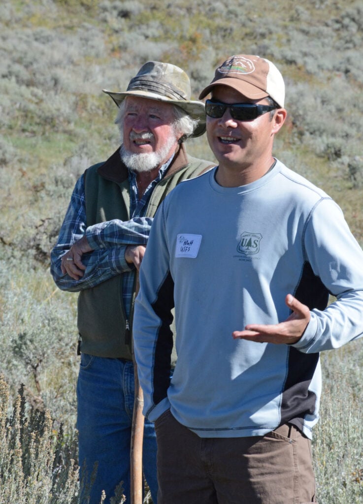 Vasquez gives a speech in a sage field.