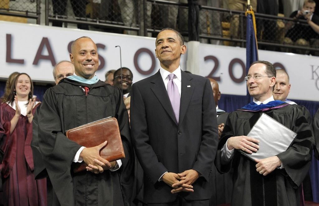 Von Washington poses next to President Barack Obama at a high school commencement.