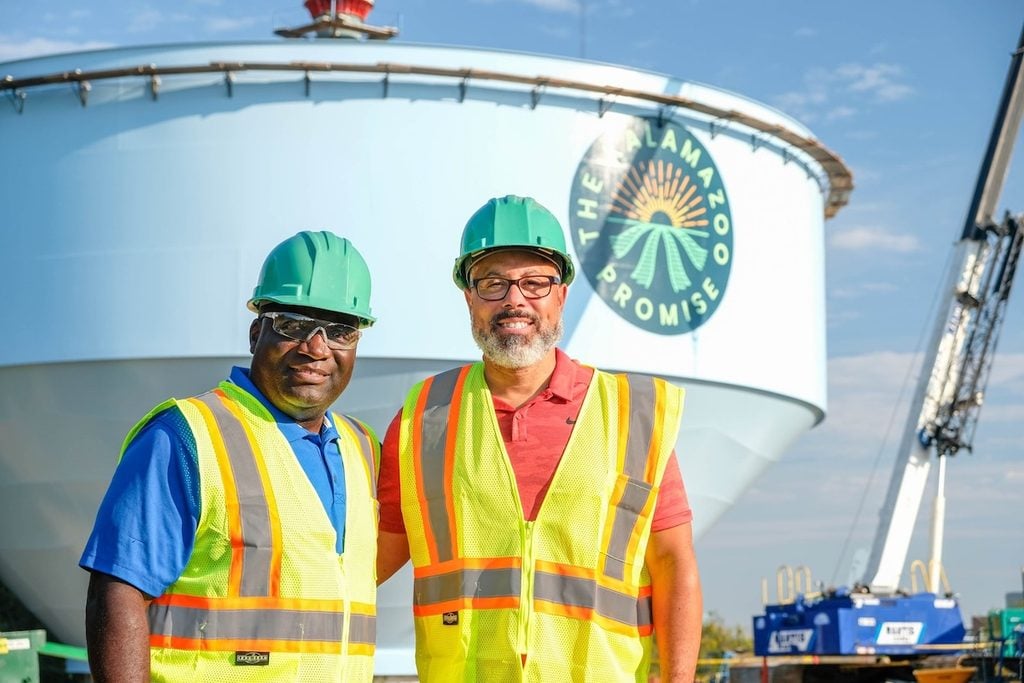 Von Washington poses in front of The Kalamazoo Promise water tower.