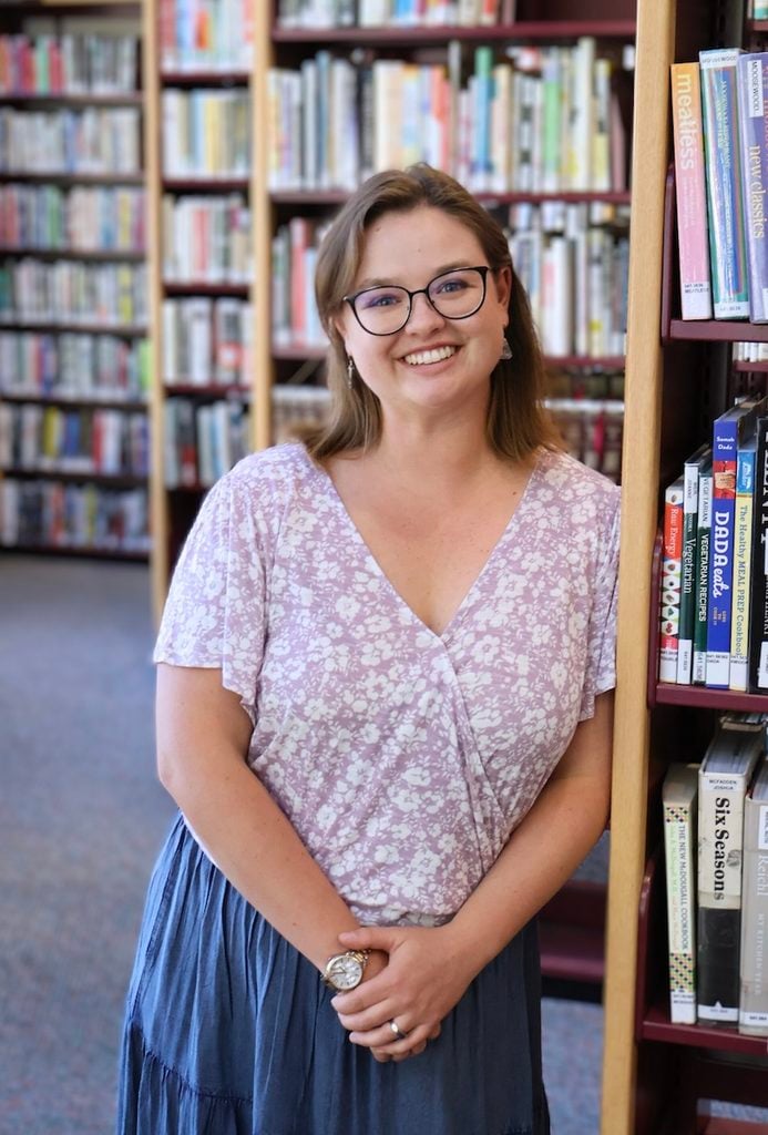 Taylor poses in the Western library.