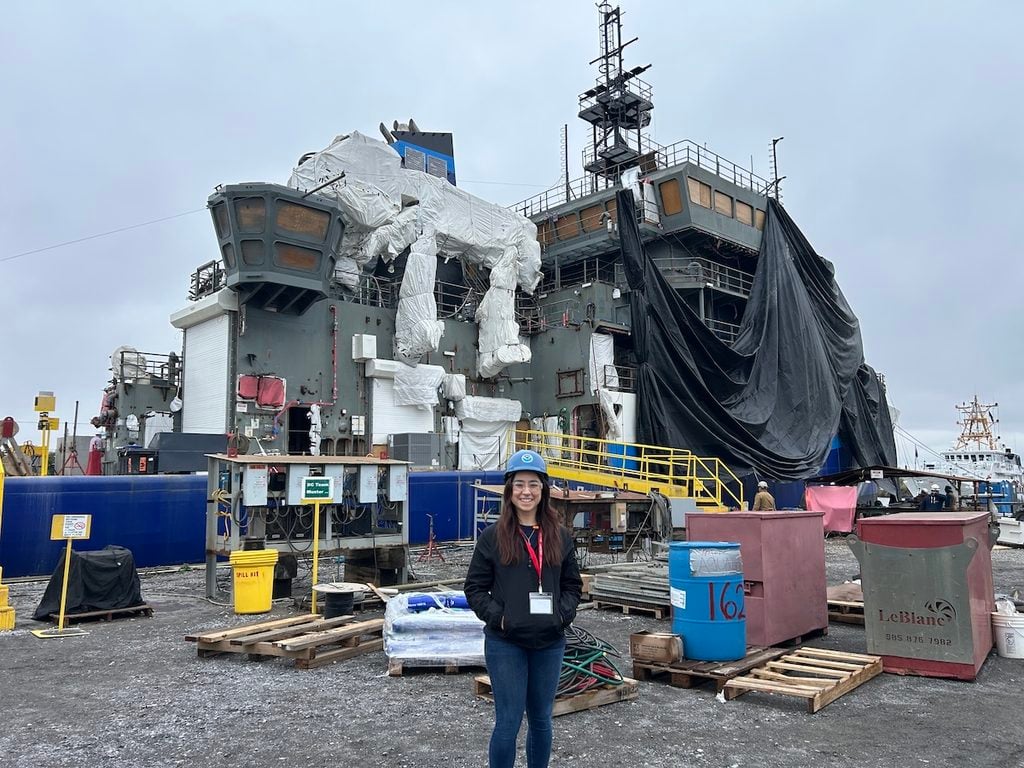 Autumn Moya poses in a ship yard.