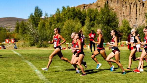 the womens cross country race begins as the women take off with the palisades behind them