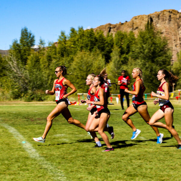the womens cross country race begins as the women take off with the palisades behind them