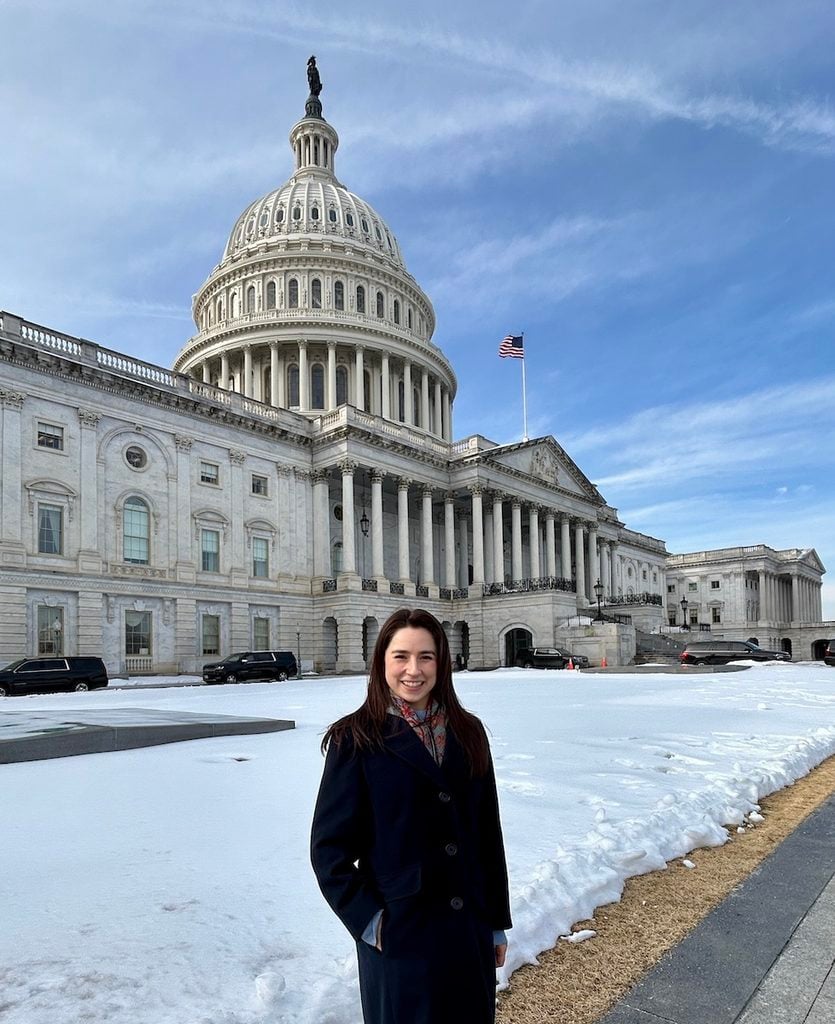 Autumn Moya poses in front of the capitol building on Capitol Hill.